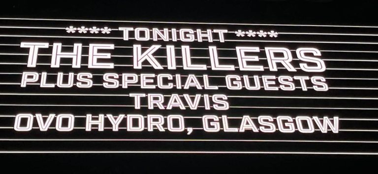 billboard för konsert med Killers och Travis i Glasgow